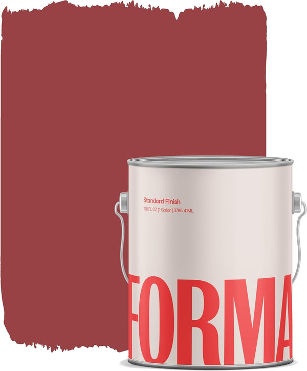 A paint can labeled FORMA, known as an Amazon paint brand, sits before a painted area of rich, dark red on a white background. Some paint appears on the can’s rim, and visible brush strokes accent the surface.