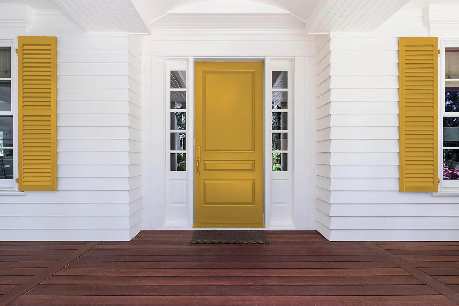 Front porch of a house with white siding, a large yellow front door coated in thick satin finish paint, yellow shutters on both sides, and dark brown wooden flooring. There are narrow windows flanking the door.